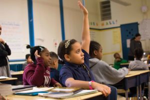 girl raising hand