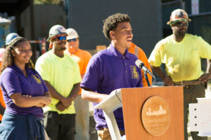 Dearborn senior addresses crowd at topping off ceremony.